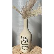 Vase en céramique avec œil
